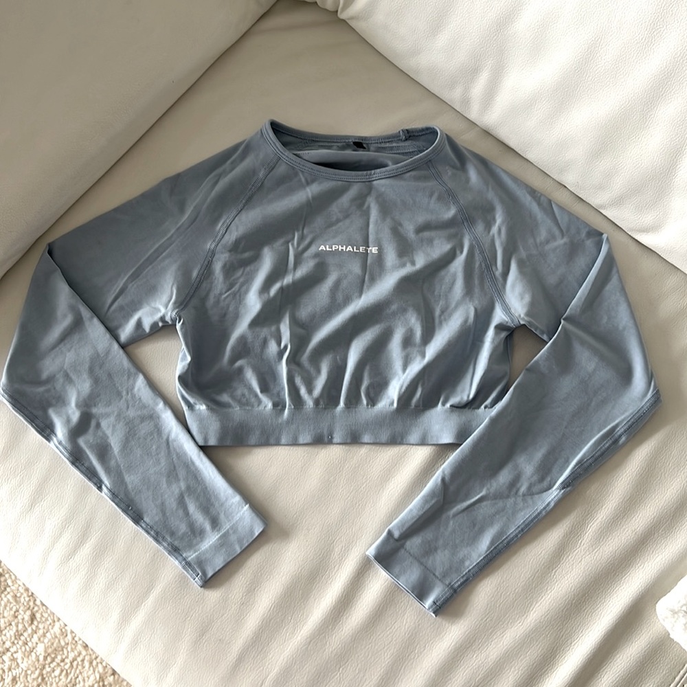 Alphalete Seamless Long Sleeve Crop Top (in Ice Blue)